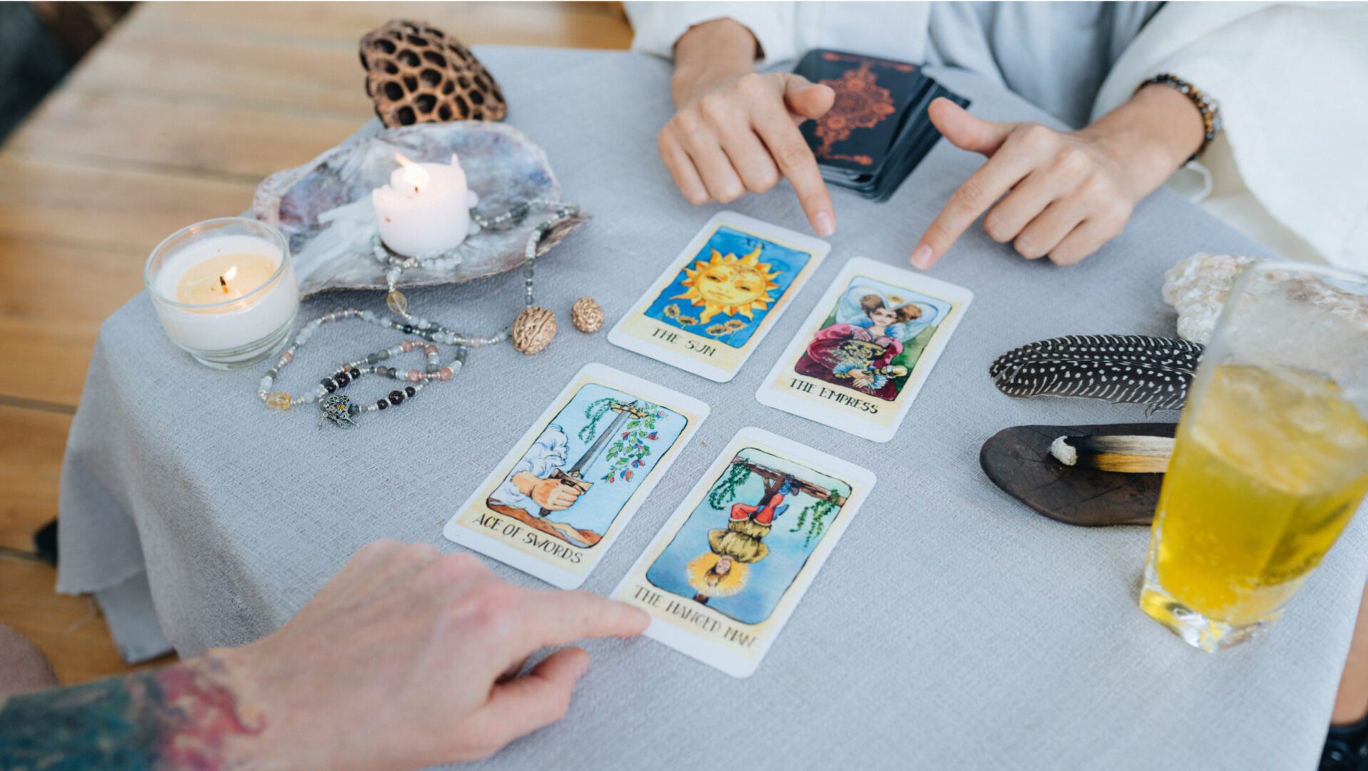 Tarot spread with decorative items nearby